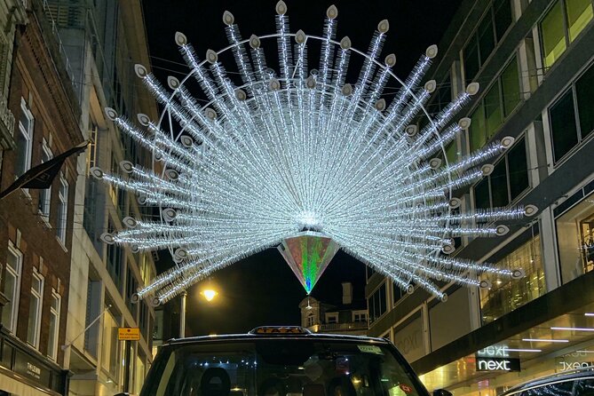 London Bespoke Black Cab Christmas Lights & Sights Private Tour - Leicester Square adds cinema and festive energy