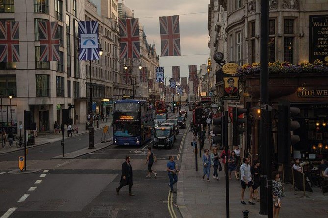 London by Night Sightseeing Open Top Bus Tour with Live Guide - Open-top views, cold air, and rainy nights