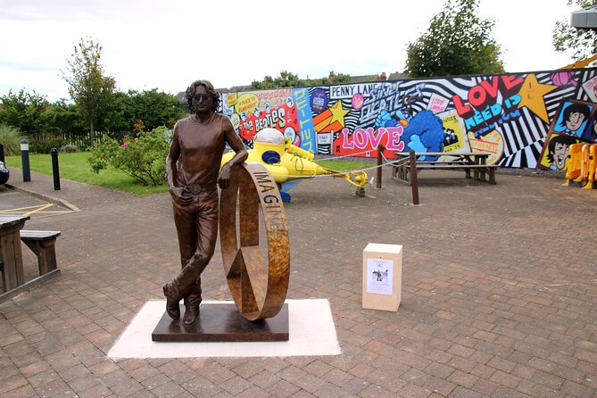 Private Beatles Car Tour, Penny Lane, Strawberry Field & childhood homes - Starting with the Beatles statues at Pier Head