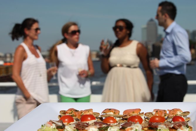 River Thames Evening Cruise with Sparkling wine and Canapés - Boarding at Tower Millennium Pier